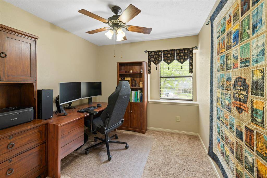 Third bedroom currently being used as an office faces the front yard and also has a ceiling fan. The home is equipped with two A/C units, each controlled by smart thermostats, making the house more energy efficient