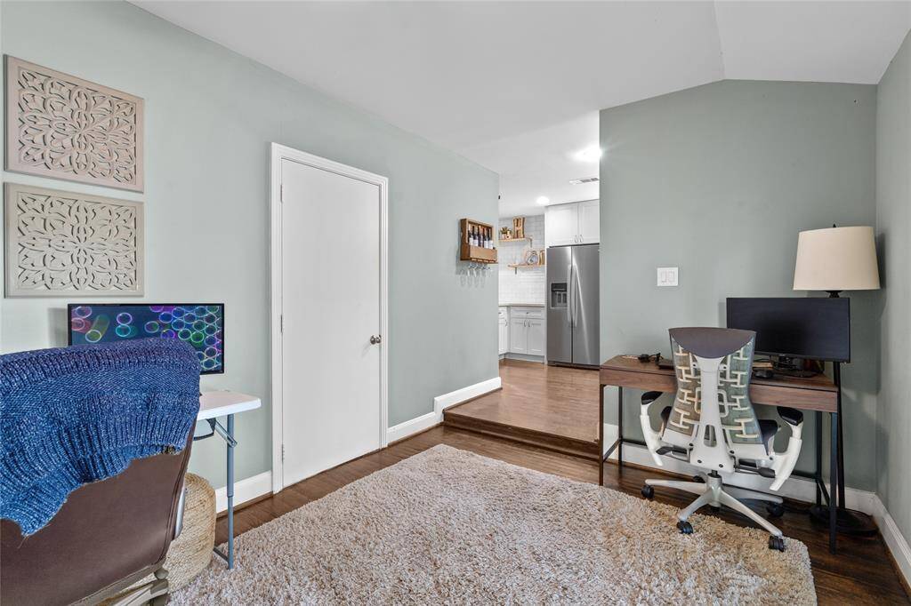 A convenient door provides direct access to the garage, making everyday comings and goings a breeze.