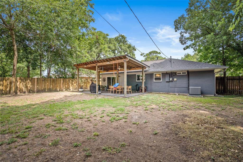 The yard features a covered patio, great for enjoying the hotter summer months.