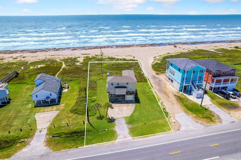 Charming beachfront home with a durable 50-year roof, fresh siding, and keyless entry—move-in ready and beautifully maintained.