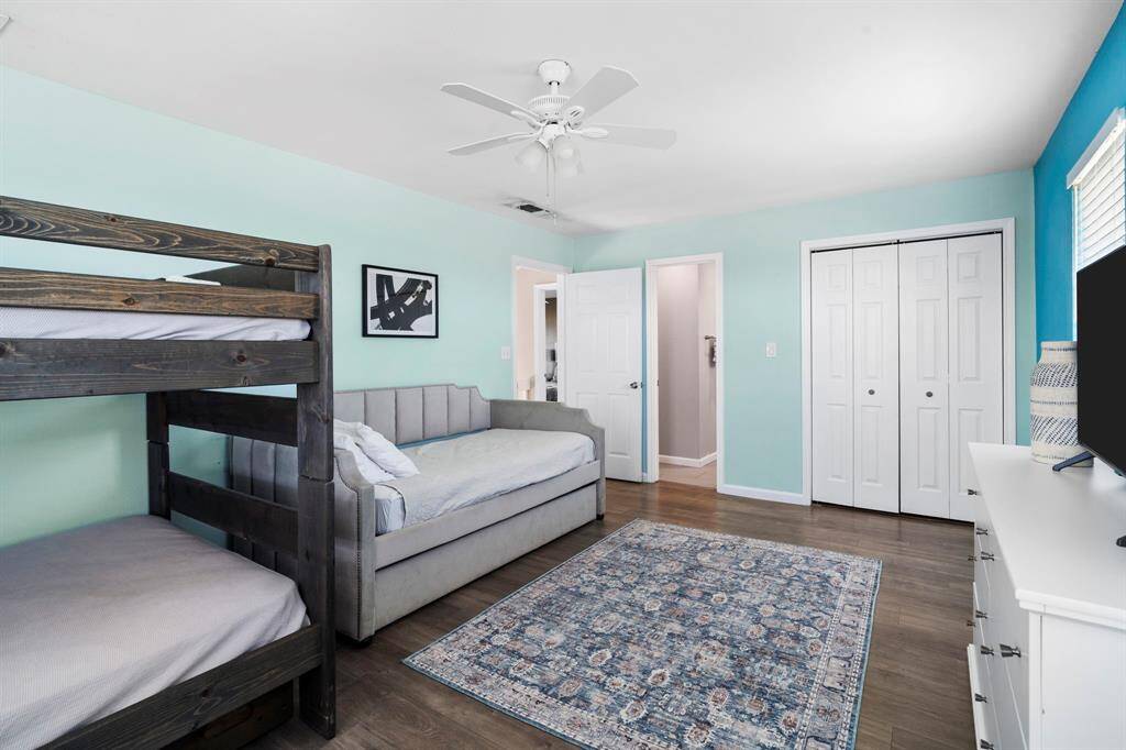 A fun and functional space with bunk beds, a trundle, and ample storage—perfect for guests or kids.