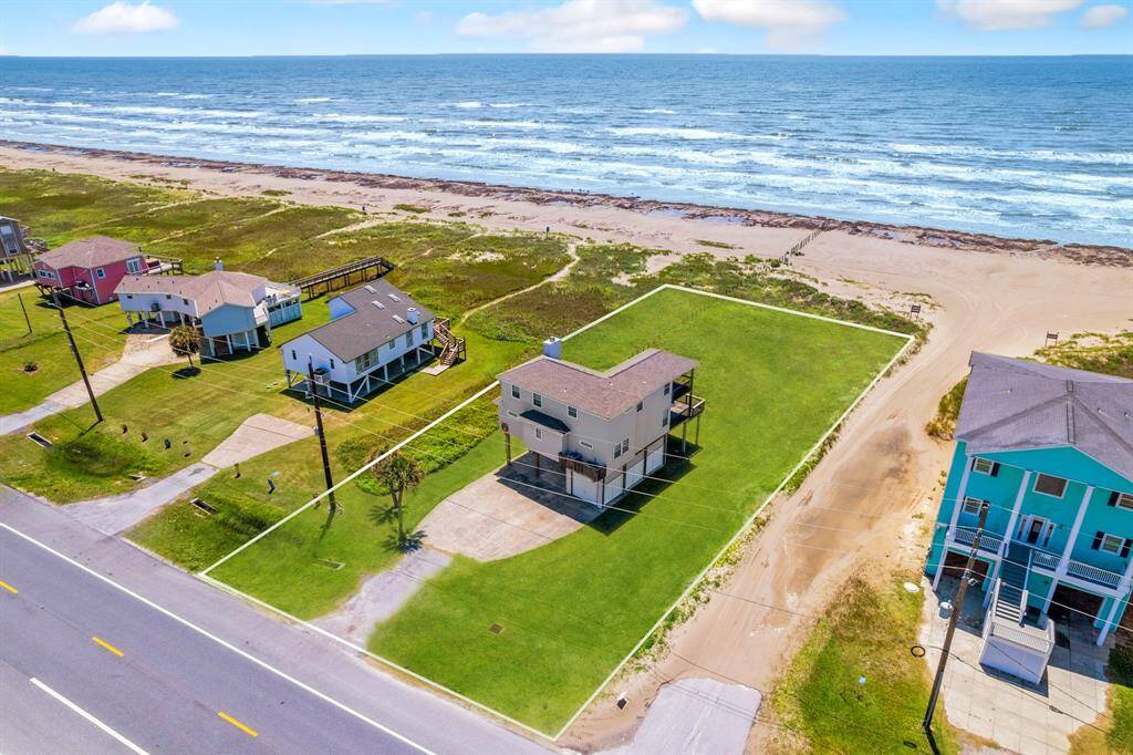 Sprawling beachfront lot just steps from the sand, offering wide Gulf views and generous space for entertaining or future additions.