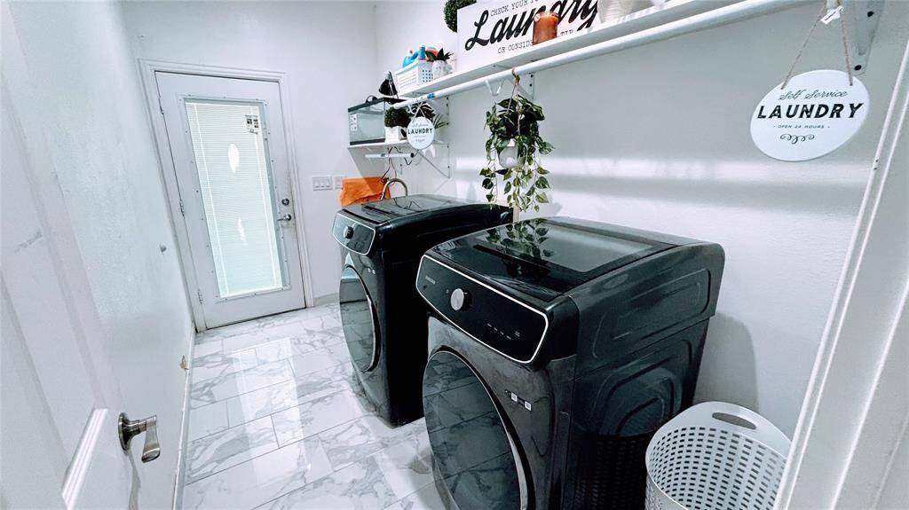 This laundry room is bright and modern.