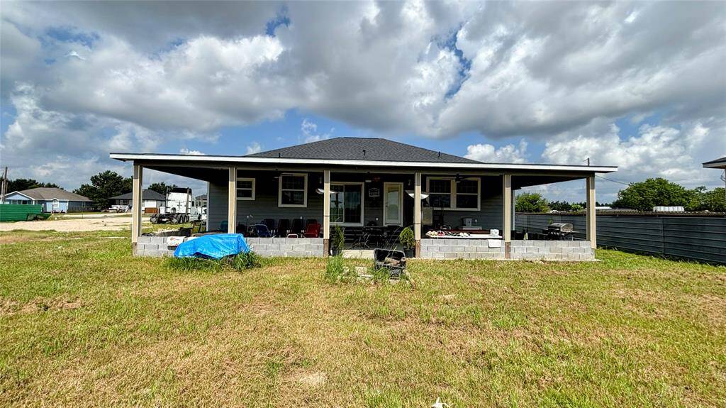 Spacious covered back patio, perfect for outdoor relaxation.