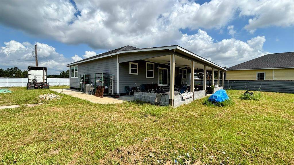Spacious covered back patio, perfect for outdoor relaxation.
