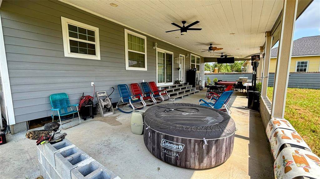 Spacious covered back patio, perfect for outdoor relaxation.