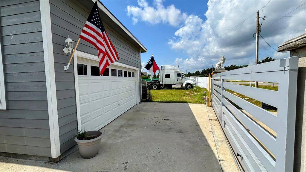 The property features a gated entrance and a well-maintained front yard.