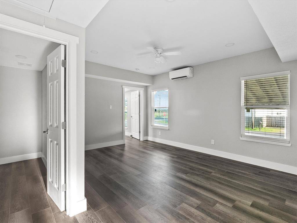 Living room and entry into full bathroom