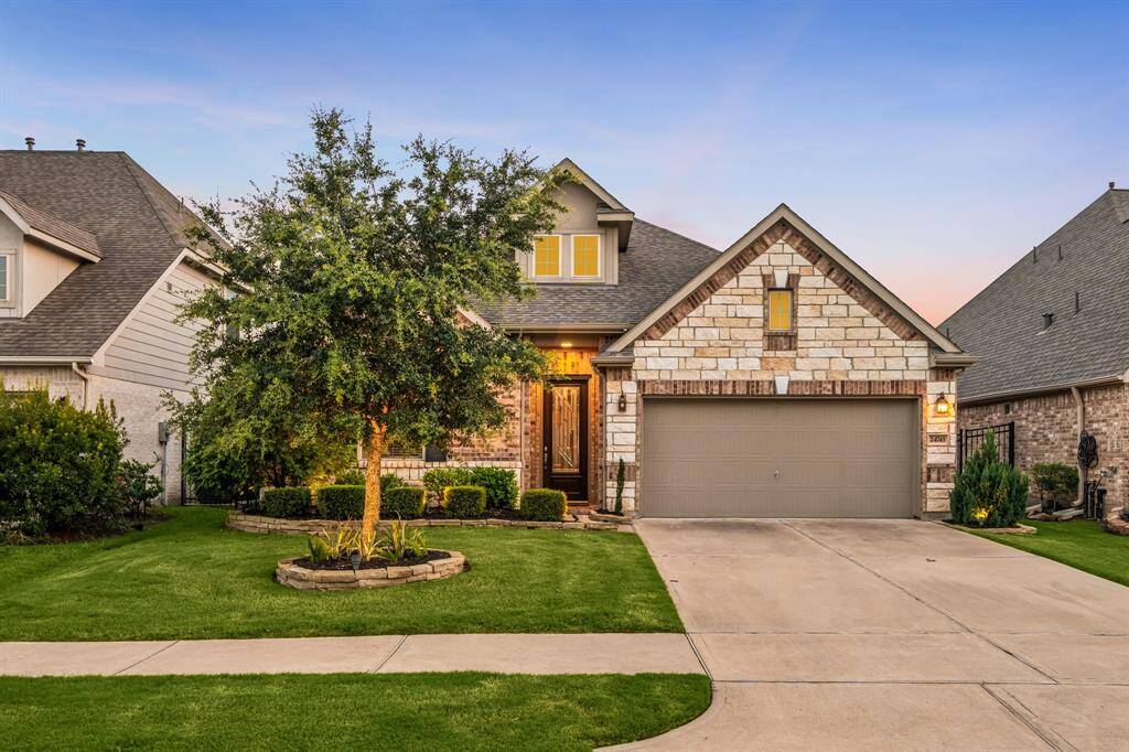 Welcome home to 24743 Levante located on a quiet street in Lakes of Bella Terra West and zoned to Lamar Consolidated ISD! This stunning home has lovely curb appeal, a well-manicured lawn, beautiful landscaping, stone/brick elevation, dark stained front door with glass detailing, covered front porch, traditional style, beautiful outdoor lanterns and a double wide driveway!