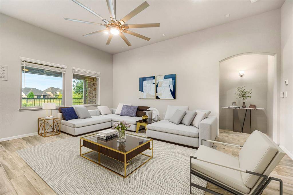 With seamless flow into the dining and living areas, this home offers comfort, sophistication, and a warm, inviting ambiance. Enjoy serene views and direct access to a covered patio, ideal for indoor-outdoor living.