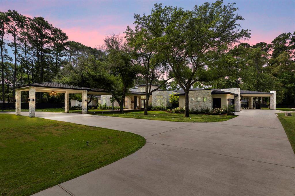 Exceptional modern Tipler-designed estate on over 2 unrestricted acres, ideally located in the heart of The Woodlands in a rare unincorporated area and zoned to sought-after Conroe ISD schools.