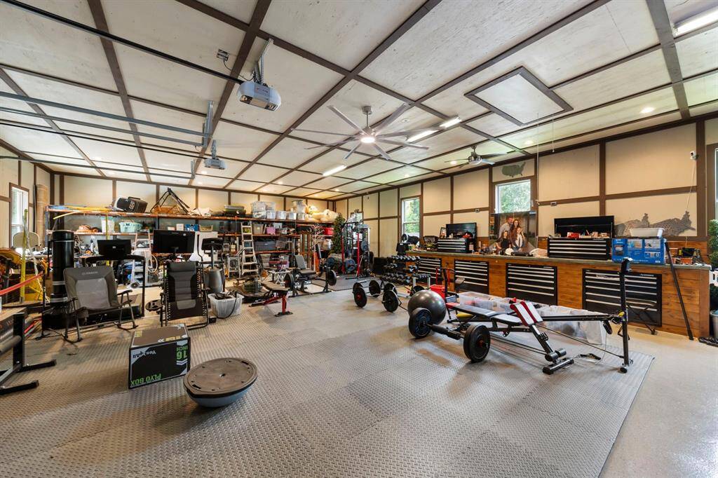 Massive climate-controlled garage offers endless flexibility—perfect for a home gym, workshop, hobby space, or additional storage.