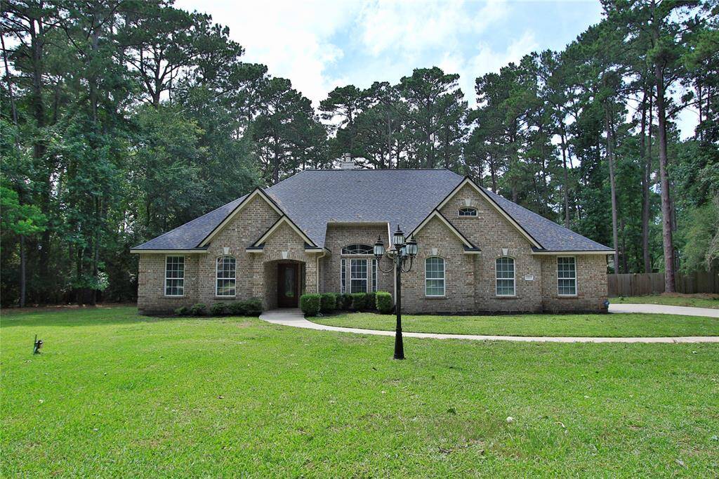 2523 Half Hollow Court -- Welcome Home!  This charming all-brick home has a gabled roof & is nestled amidst tall trees on just over an acre.
