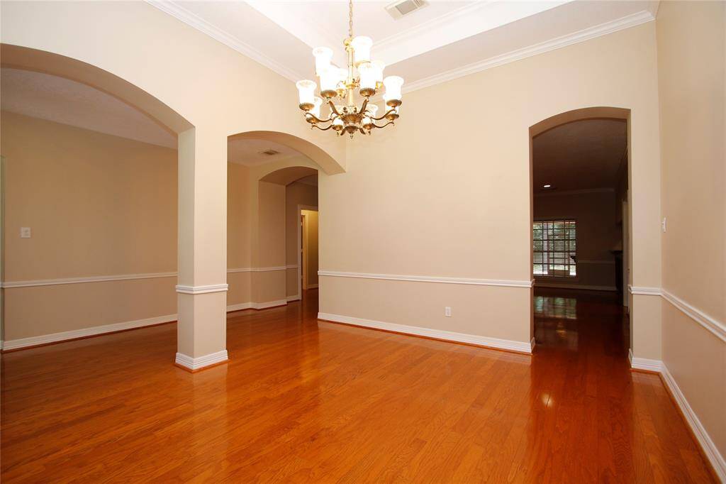 A view of the entry hallway that leads to the family room as well as second entrance from family room/kitchen.
