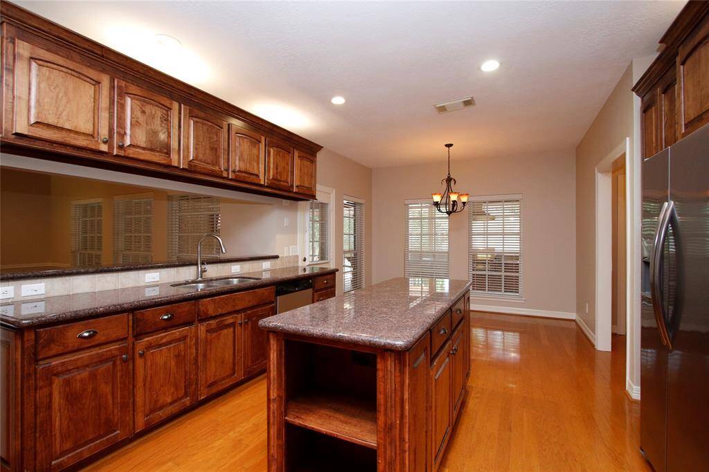 More windows for the breakfast nook and views to covered patio, outdoor kitchen and huge backyard.