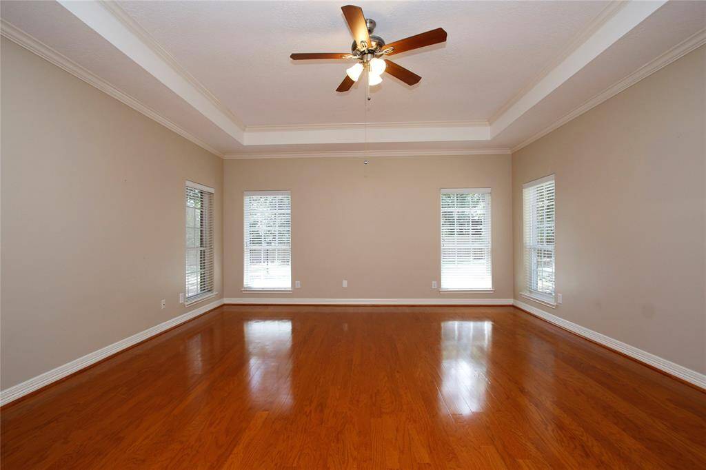 Huge master bedroom continues all the features of the home with beautiful hardwood floors, neutral walls, and tray ceiling. It has abundant natural light with views of the large back yard.  Just an inviting and relaxing atmosphere to start and end your days.
