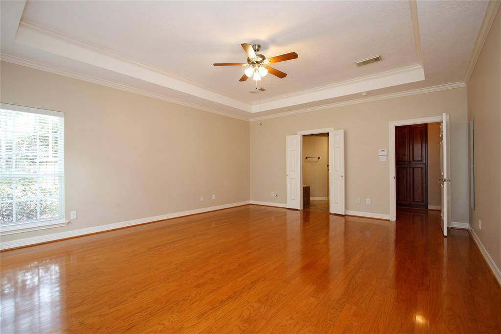 This view shows entry way to the right and primary bathroom to the left.  This master provides the privacy you need from the hustle and bustle of the kitchen and family room.