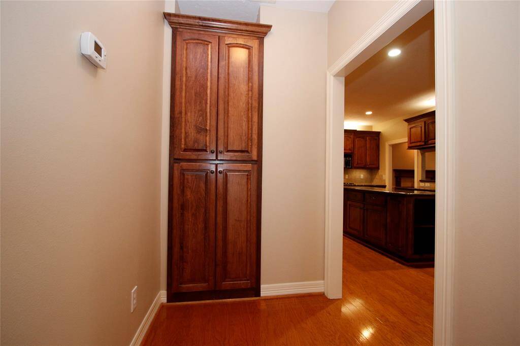 Hallway between kitchen and master bedroom features a large storage space - could be for an extra pantry error or just more storage -- who doesn't need more storage!