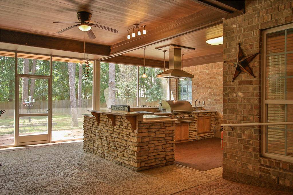 It is an actual kitchen with moster grill, vent hood, sink, gas stove and various grill gadgets.  Outdoor living at its best!