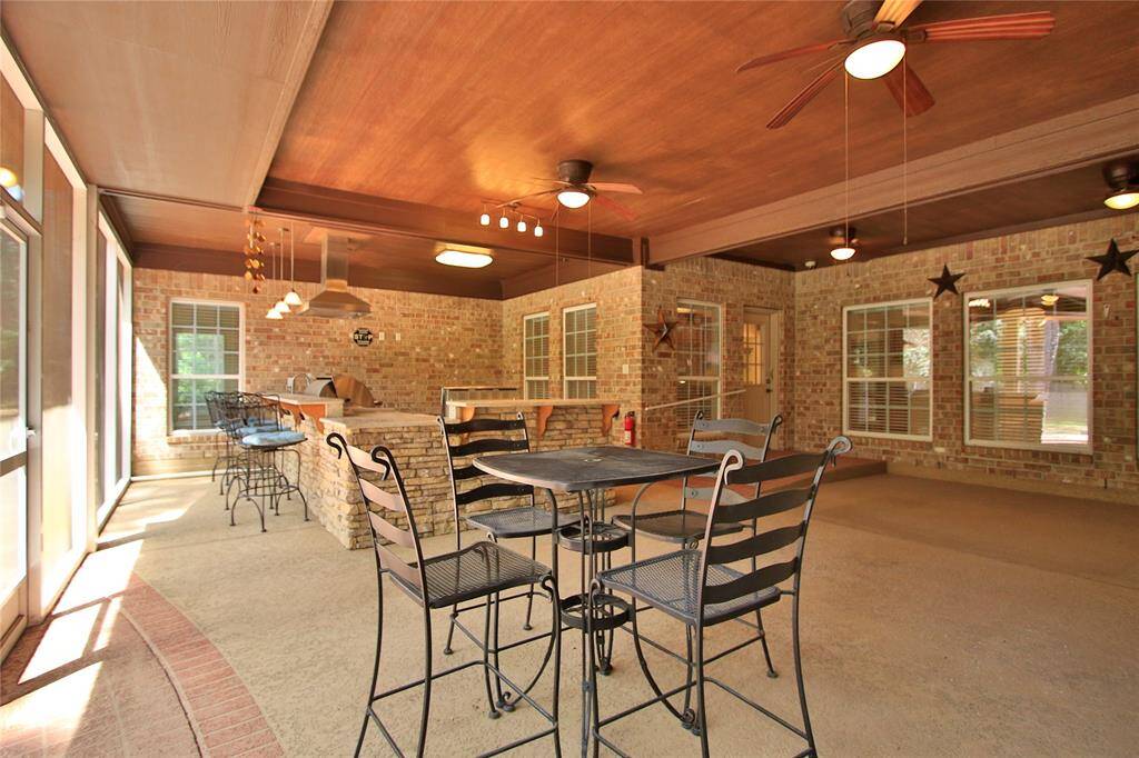 Did I mention the built-in bar - granite counter tops - Rod Iron patio set and bar stools are ready and waiting for you.