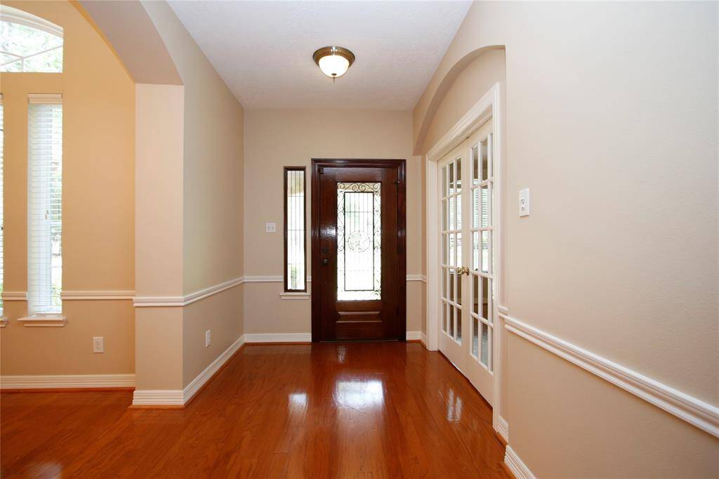 Double French doors lead to the office at the front of the home.