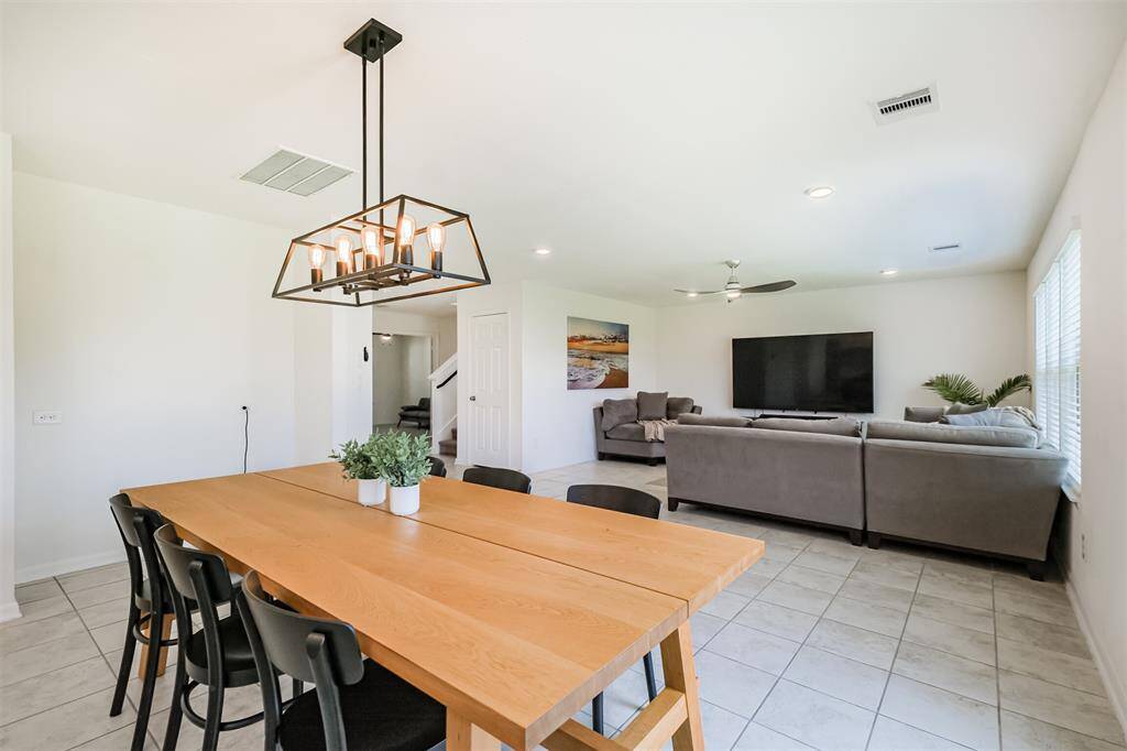 Imagine gathering with friends and/or family in this bright, open dining area that flows effortlessly into your future living room.