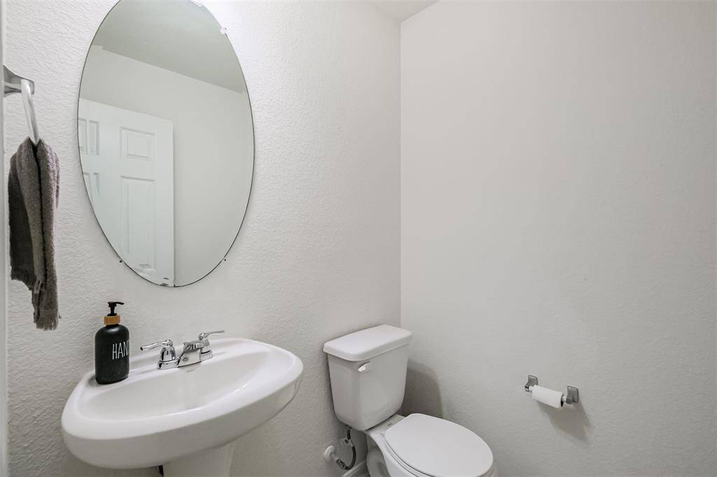 Conveniently located on the main floor, this half bath is perfect for guests and everyday use. With its practical layout, it adds comfort and ease to your daily routine.
