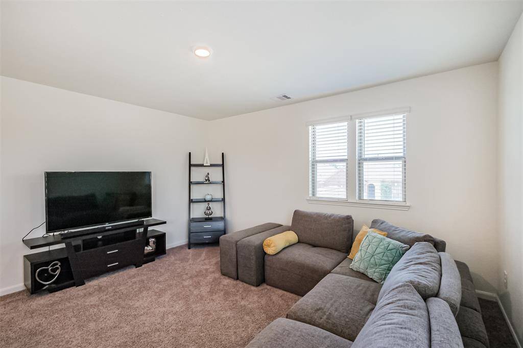 Your upstairs retreat awaits! Ideal as a game room, home gym, or cozy lounge for movie nights.