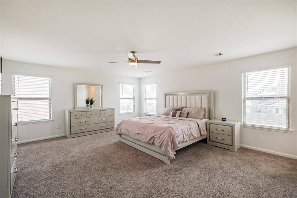 Step into your future sanctuary- this massive primary bedroom is a true retreat.