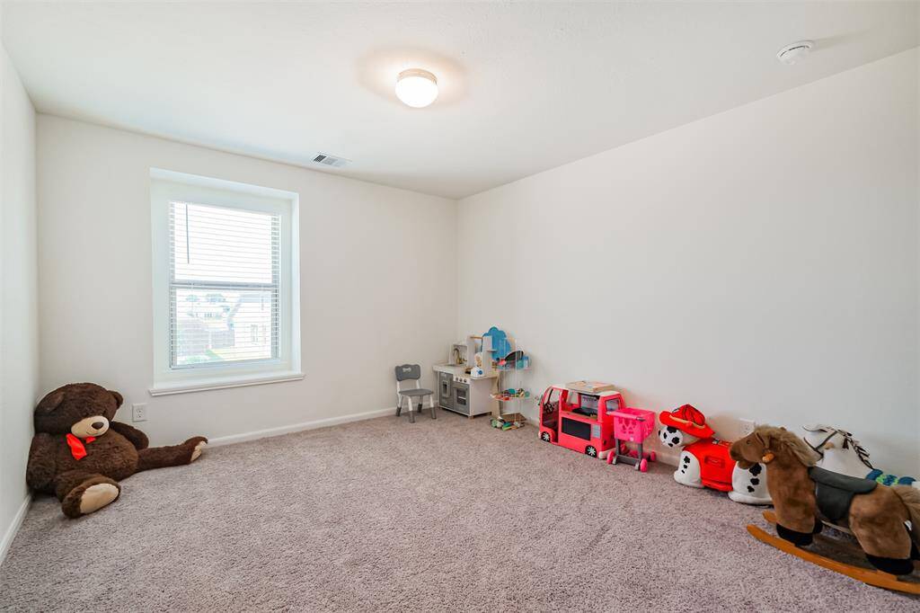 This bedroom is currently used as a fun playroom- but the possibilities are endless!