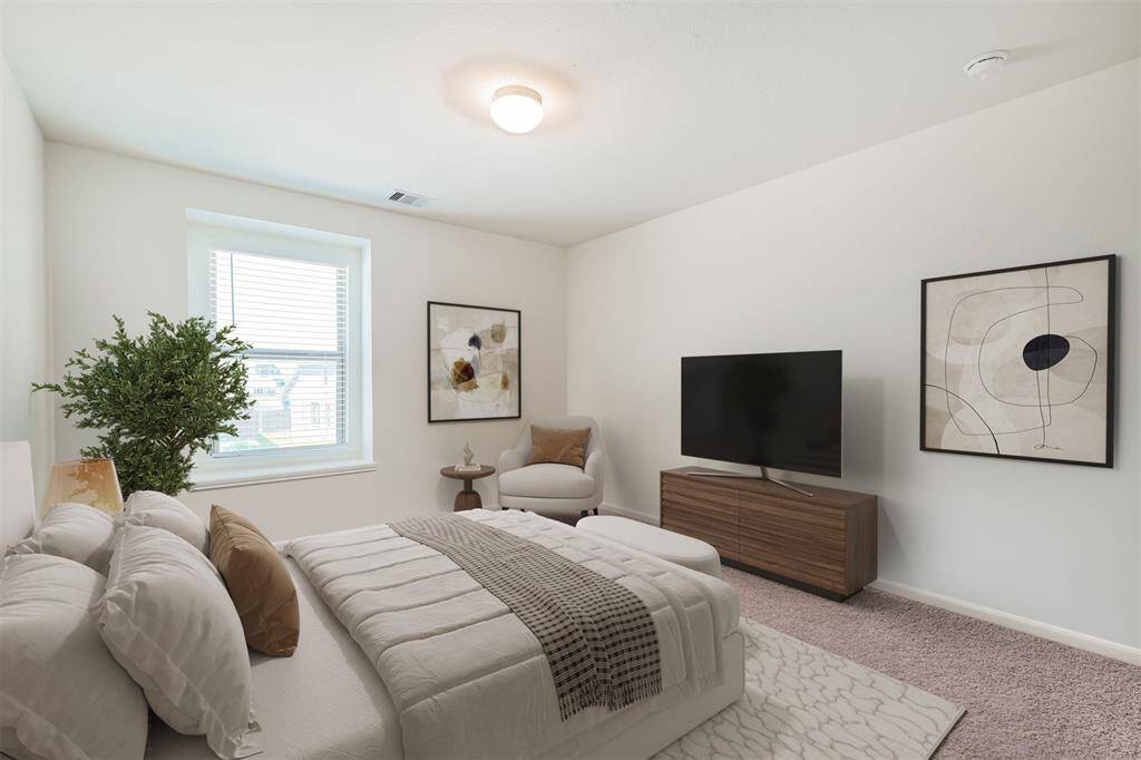 This photo has been virtually staged to help you envision how this secondary bedroom (currently used as a playroom) could be used as a cozy and functional sleeping space.