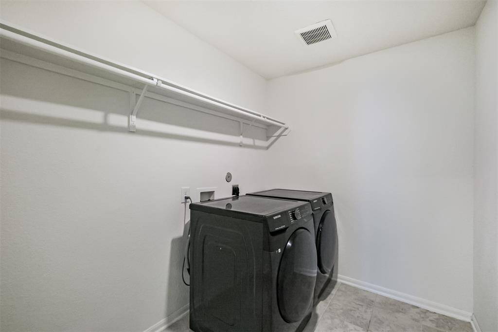 Laundry day just got easier! this utility room is perfectly placed and offers the space and setup you need for a smooth and simple laundry routine.
