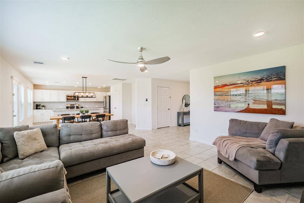 Another view of the inviting living area, showcasing its seamless flow and spacious layout.