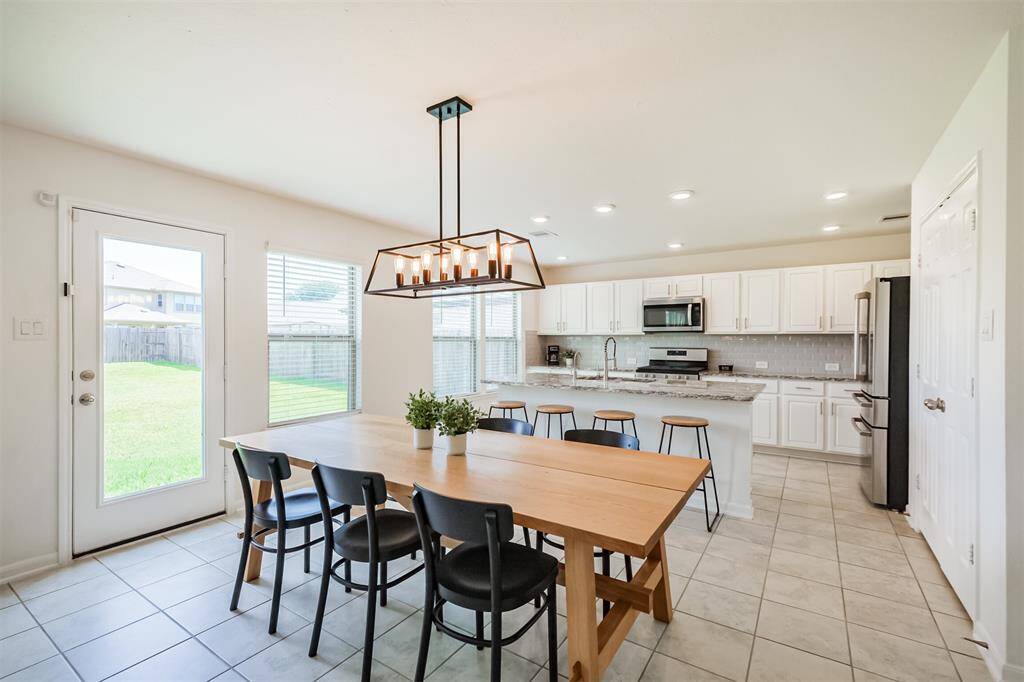 welcome to your future dining space- where elegance meets everyday comfort. Picture yourself enjoying meals under the stunning chandelier, with the beautifully designed kitchen just steps away.