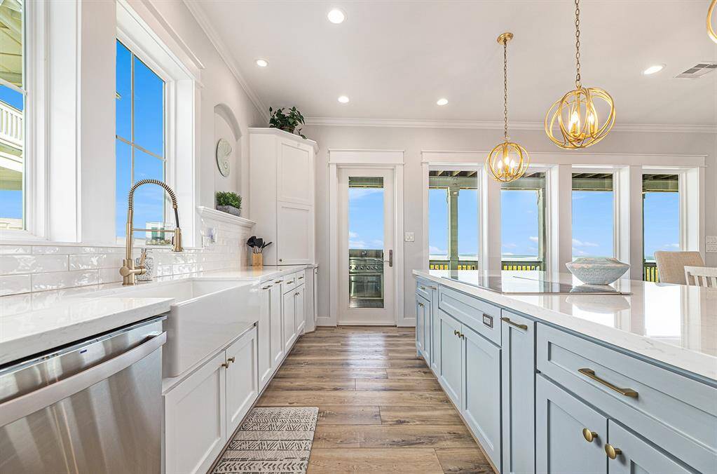 Kitchen island with prep space and stove top built in.