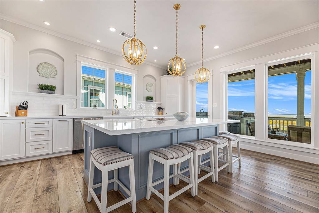 Kitchen with a centered island to allow for prep and cooking while spending time with family and friends.