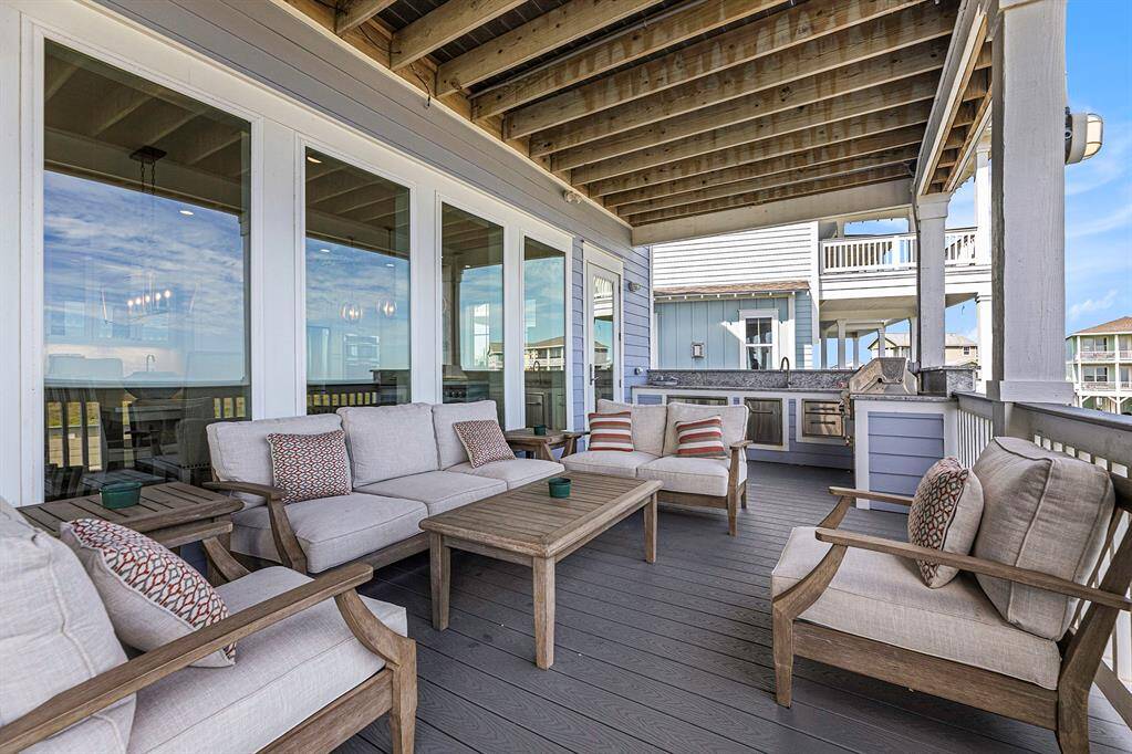 First floor balcony with outdoor sink and grill area.