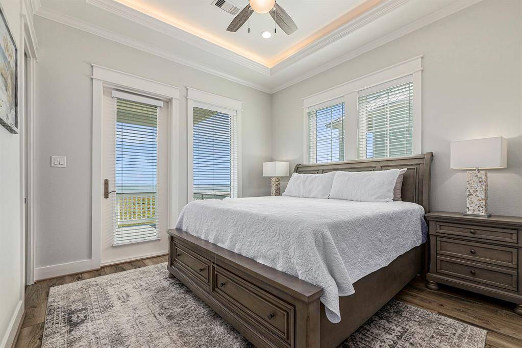 King size bedroom #1 on second floor with entry to balcony.