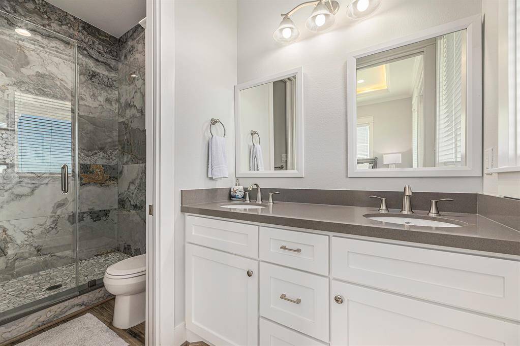 King size bedroom #1 bathroom with double sinks.