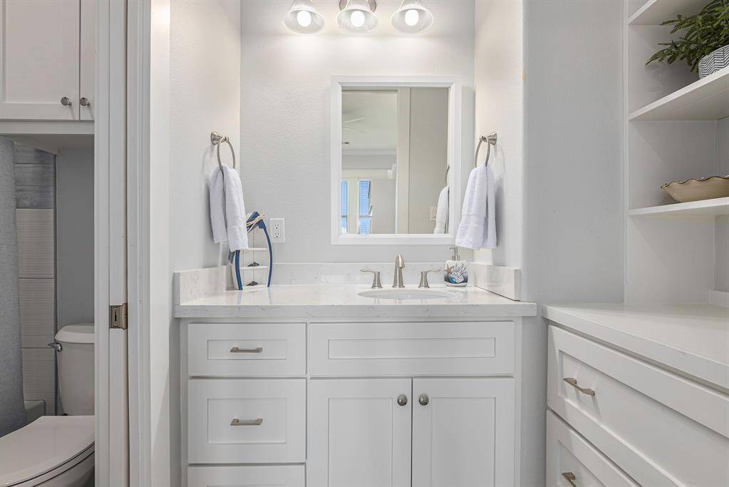 6 bunk bathroom. Toilet and shower have a pocket door to separate from the sink area with plenty of storage.