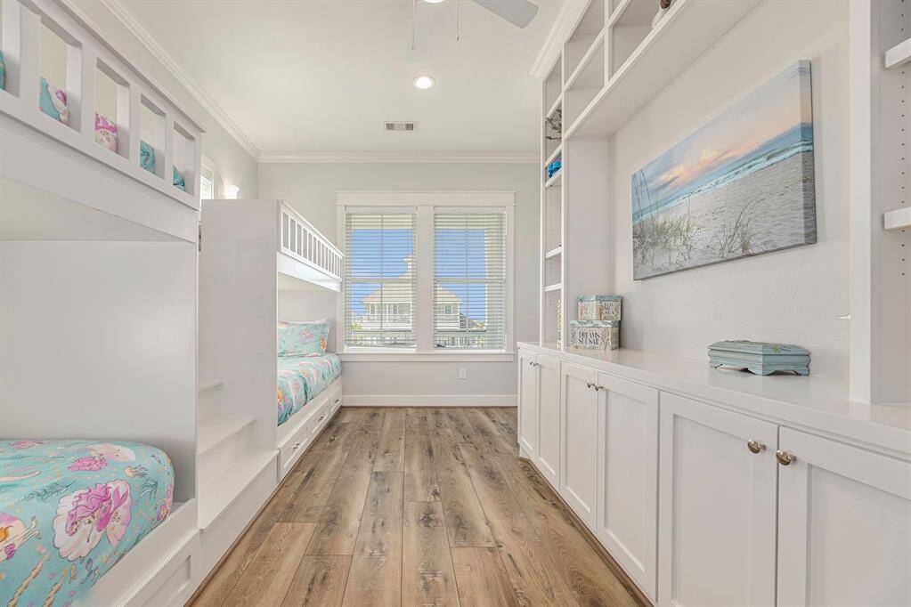 Four bunk room on second story with lots of storage space and an attached full bathroom.
