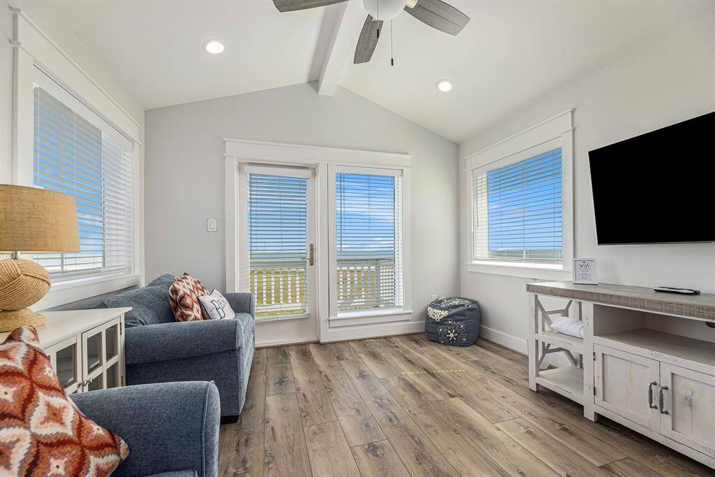 3rd story loft area with entrance to a high balcony that provides an expansive view of the ocean.