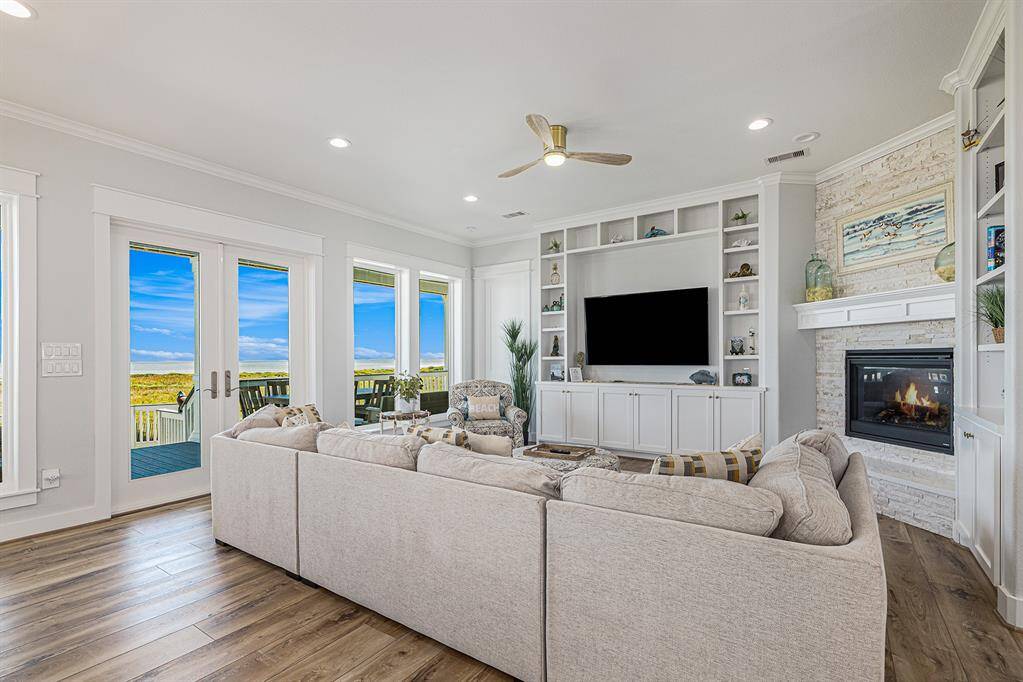 Living room with TV and fireplace.