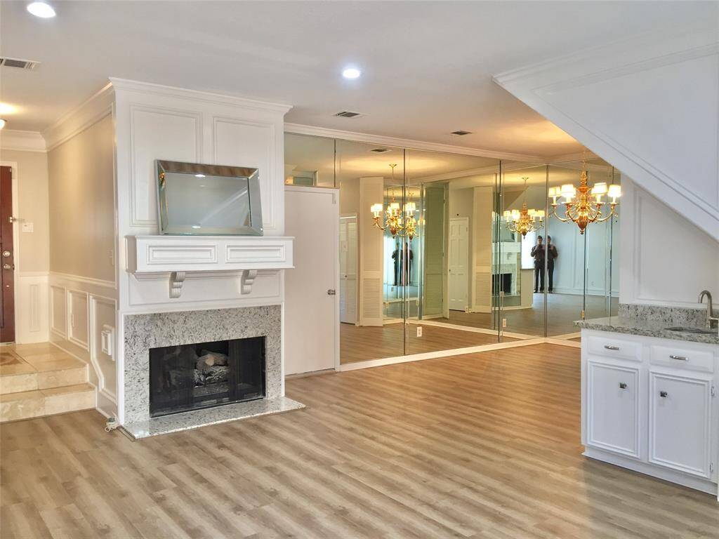Mirrored DINING ROOM, Fireplace with gas logs, and Wet Bar with granite countertop.
