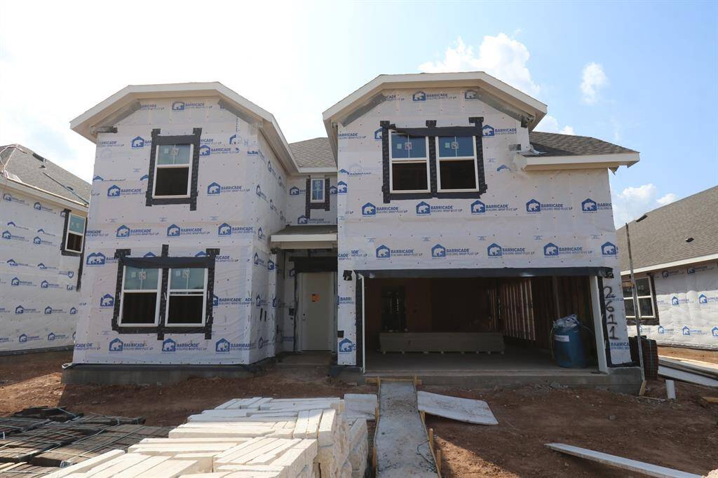 Two story home with 5 bedrooms, 4.5 baths, and 3 car garage.