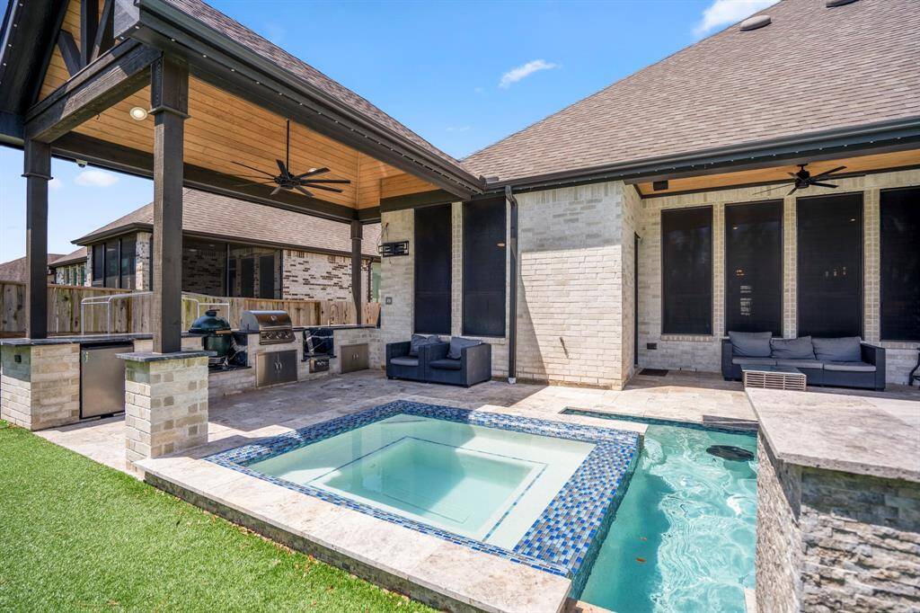 Two spacious covered patios provide ample shade and comfortable seating areas, making indoor-outdoor living effortless.