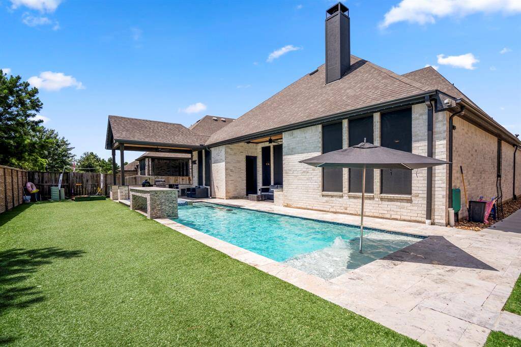 Low-maintenance artificial turf completes the space with lush, green appeal all year long—without the upkeep.