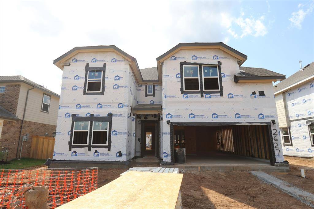 Two story home with 5 bedrooms, 4.5 baths, and 3 car garage.
