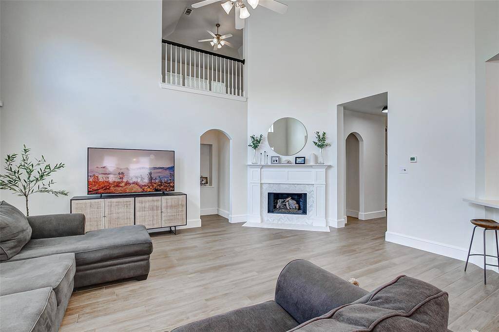 At the heart of the home, the expansive family room will capture your attention with its impressive scale and inviting ambiance.