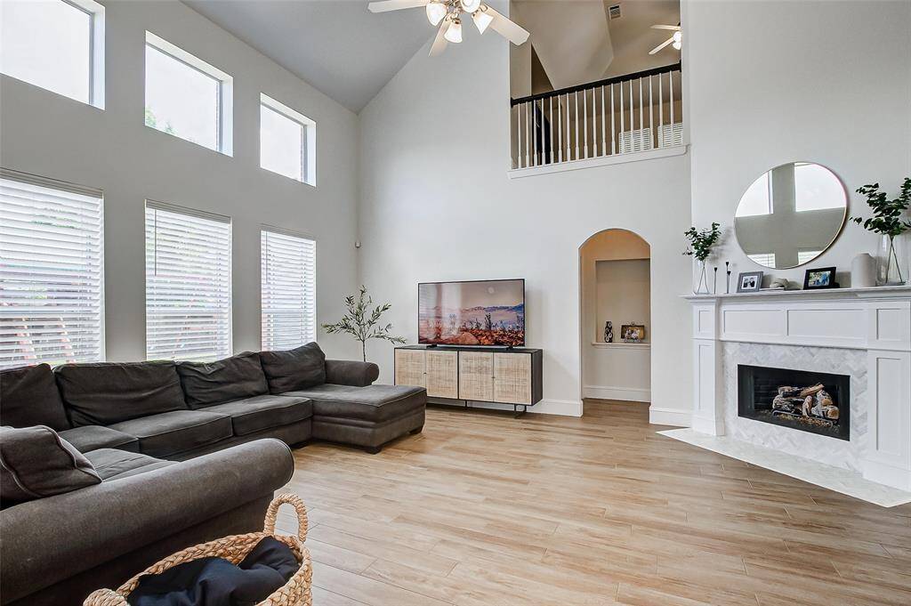 The soaring ceilings create an airy, open feel, while the gleaming tile flooring adds a touch of sophistication and easy maintenance.